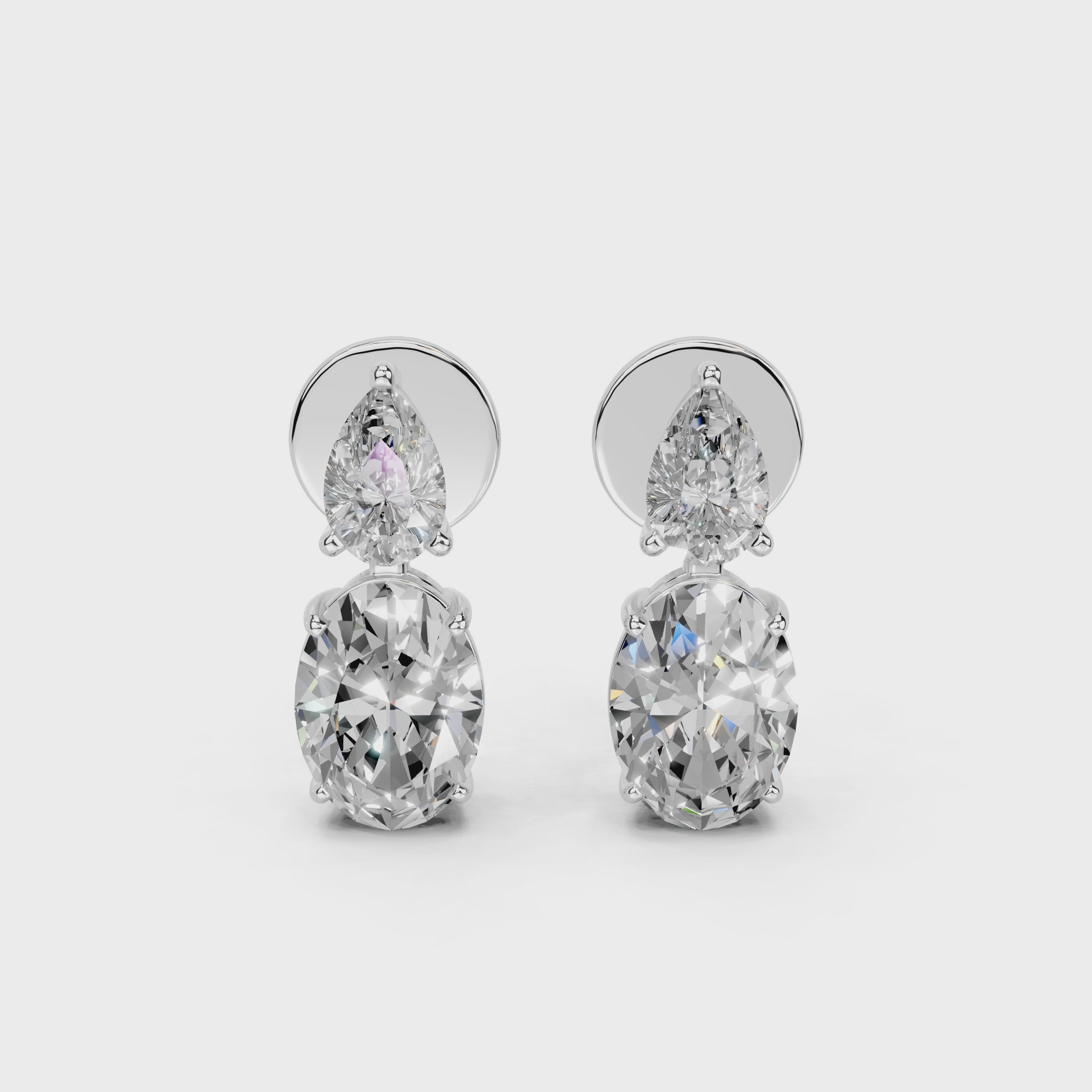 Two stone pear and oval 3.9 cttw lab grown diamond earrings