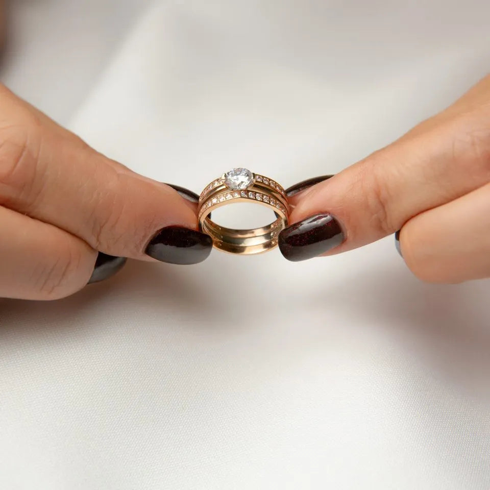 woman-s-hands-are-holding-ring-with-diamond-it-scaled-1-960x960.webp